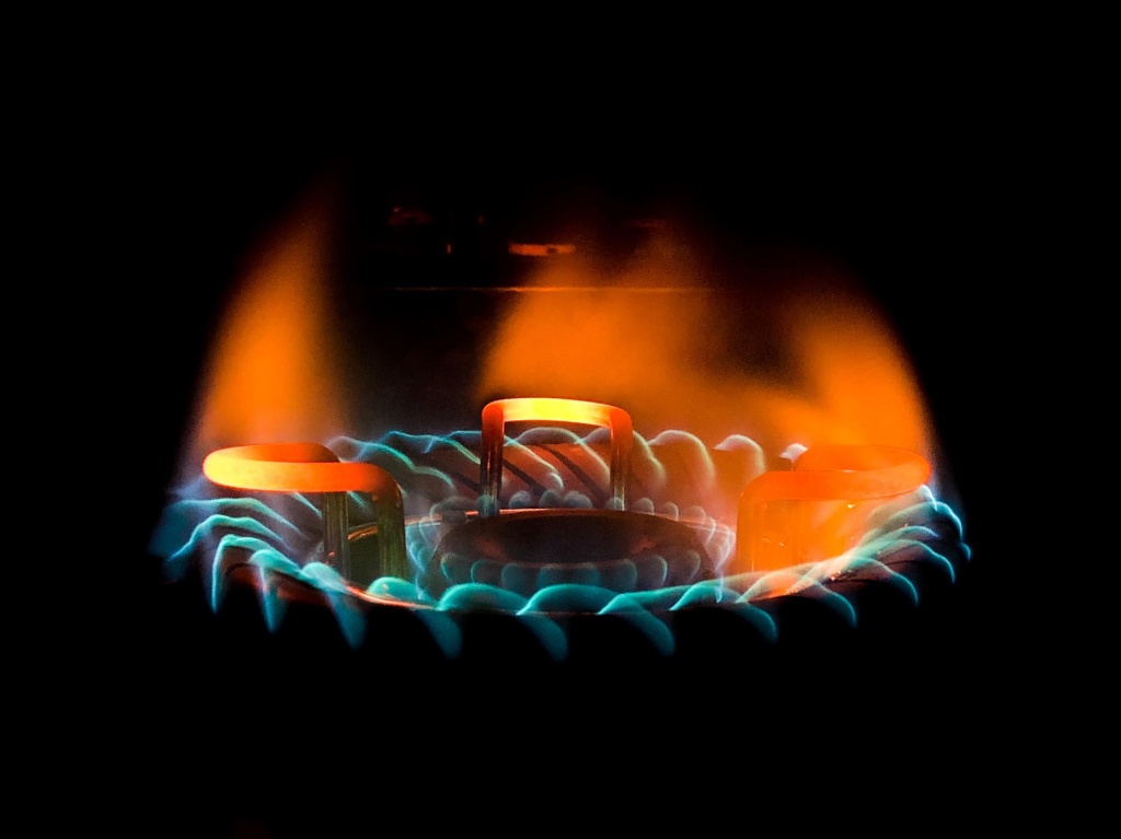 closeup-shot-of-a-beautiful-blue-green-flame-in-a-gas-stove-min.jpg